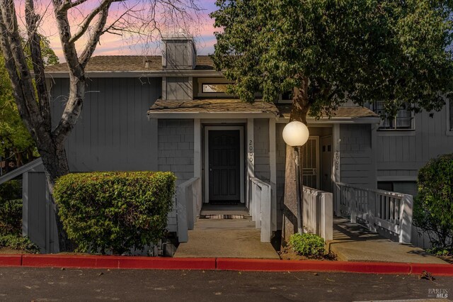 2000 Clearview Cir, Benicia, CA 94510 - view of front of house featuring roof with shingles and a chimney