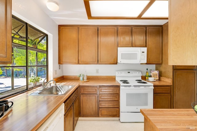 2000 Clearview Cir, Benicia, CA 94510 - kitchen featuring white appliances, a sink, butcher block counters, and brown cabinets