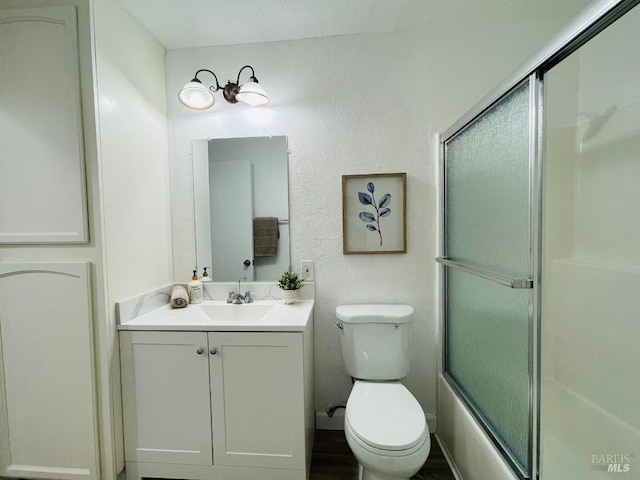 225 Pennsylvania Ave Unit B1, Fairfield, CA 94533 - bathroom with vanity, toilet, and bath / shower combo with glass door