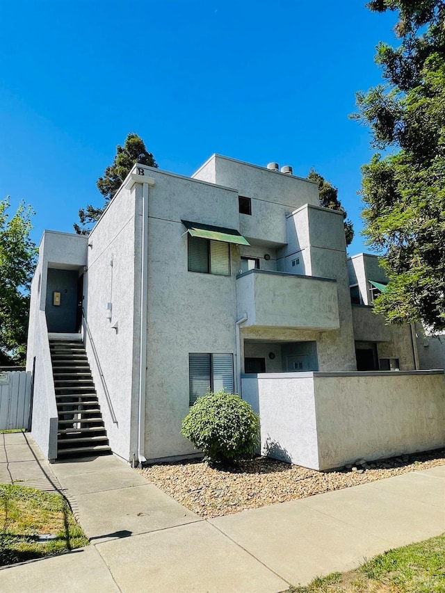 225 Pennsylvania Ave Unit B1, Fairfield, CA 94533 - view of home's exterior featuring stucco siding and stairs