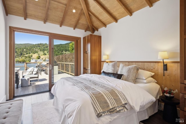 189 Seadrift Rd, Stinson Beach, CA 94970 - bedroom with wooden ceiling with exposed beams, access to outside, wood finished floors, wooden walls, and a wainscoted wall