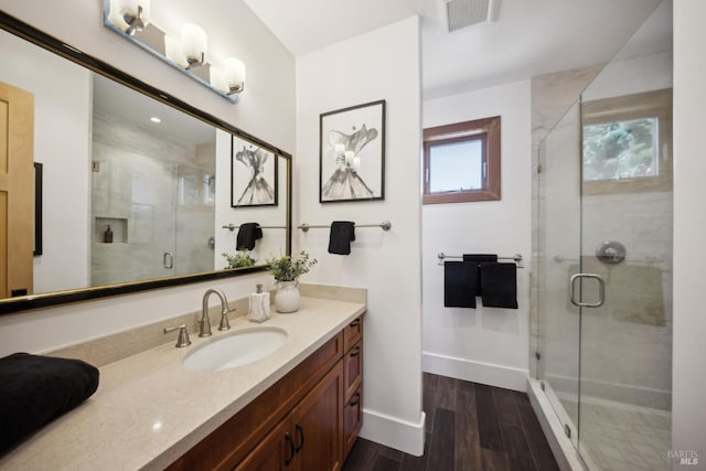 189 Seadrift Rd, Stinson Beach, CA 94970 - bathroom featuring vanity, a shower stall, baseboards, and wood finished floors