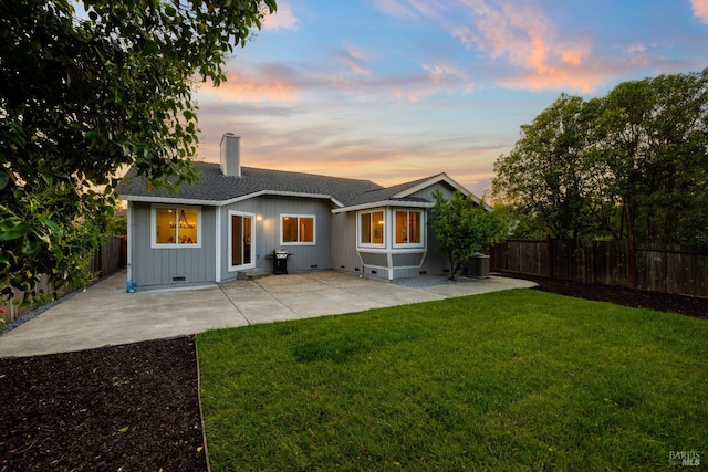 2410 Pinercrest Dr, Santa Rosa, CA 95403 - back of house at dusk with a chimney, cooling unit, a patio, and a shingled roof