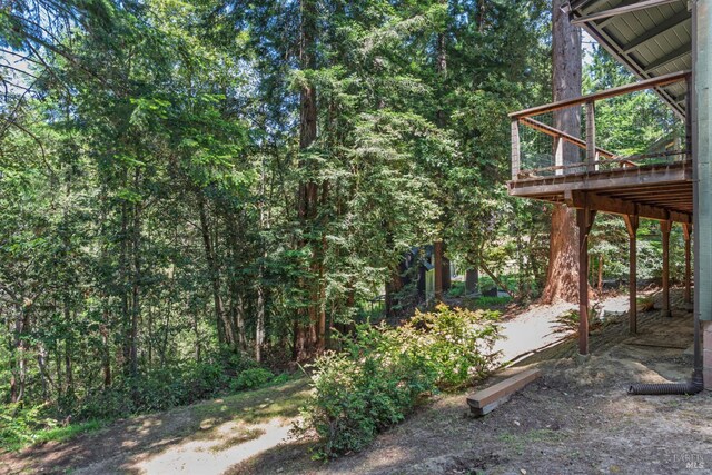 45270 Ocean View Ln, Gualala, CA 95445 - view of yard featuring a deck and a view of trees
