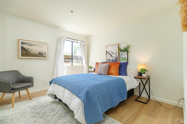 8201 Camino Colegio Unit 17, Rohnert Park, CA 94928 - bedroom with light wood finished floors and baseboards