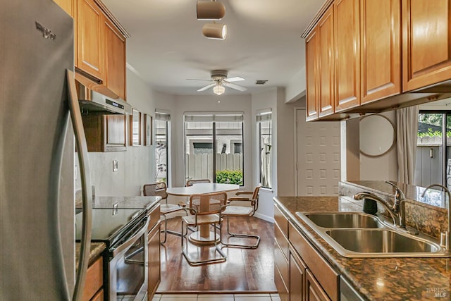 111 Cheda Ln, Novato, CA 94947 - kitchen featuring stainless steel appliances, a sink, under cabinet range hood, ceiling fan, and brown cabinets
