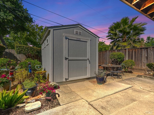 1233 Lincoln St, Fairfield, CA 94533 - view of shed featuring a fenced backyard and outdoor dining area