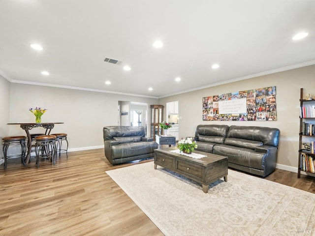 1233 Lincoln St, Fairfield, CA 94533 - living room featuring crown molding, light wood-style flooring, baseboards, and recessed lighting
