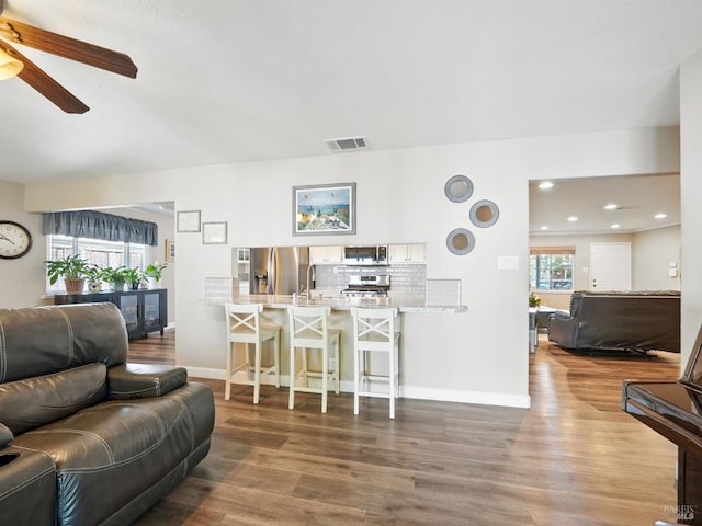 1233 Lincoln St, Fairfield, CA 94533 - living area featuring ceiling fan, wood finished floors, baseboards, and recessed lighting