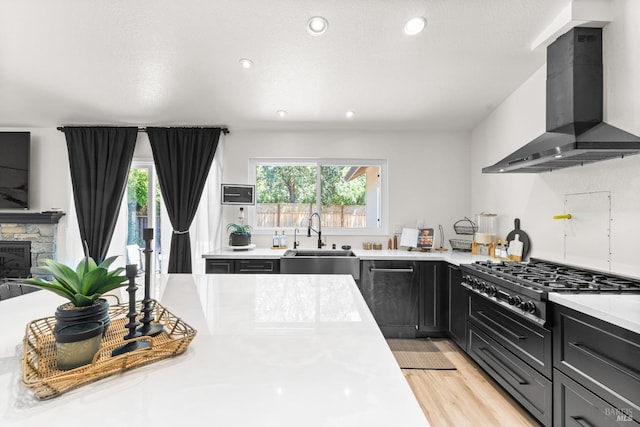 9508 Jessica Dr, Windsor, CA 95492 - kitchen with extractor fan, gas stovetop, a sink, light countertops, and recessed lighting