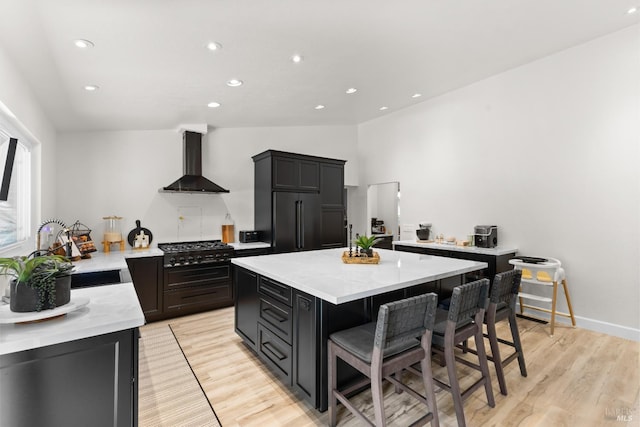 9508 Jessica Dr, Windsor, CA 95492 - kitchen with wall chimney range hood, high end fridge, stovetop, a sink, and recessed lighting