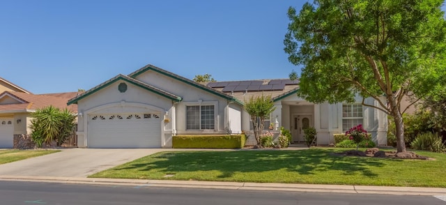 3543 Oak Shores Dr, Stockton, CA 95209 - single story home with a tiled roof, an attached garage, roof mounted solar panels, concrete driveway, and a front yard