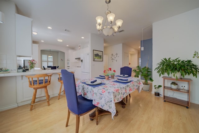3543 Oak Shores Dr, Stockton, CA 95209 - dining room featuring light wood-type flooring, a chandelier, and recessed lighting
