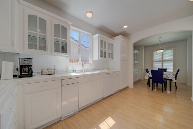 3543 Oak Shores Dr, Stockton, CA 95209 - kitchen with dishwasher, arched walkways, tasteful backsplash, and recessed lighting