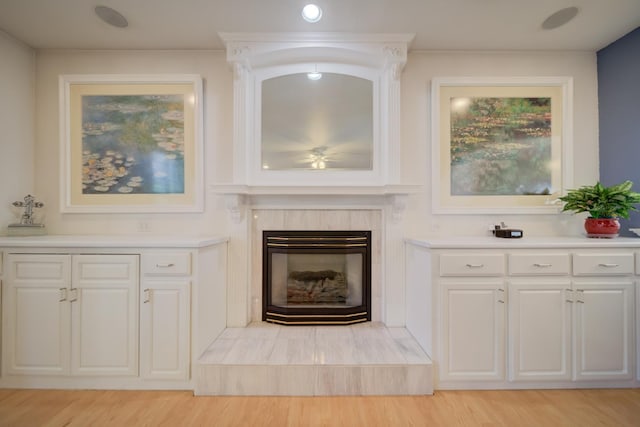 3543 Oak Shores Dr, Stockton, CA 95209 - detailed view of wood finished floors, a high end fireplace, and ceiling fan