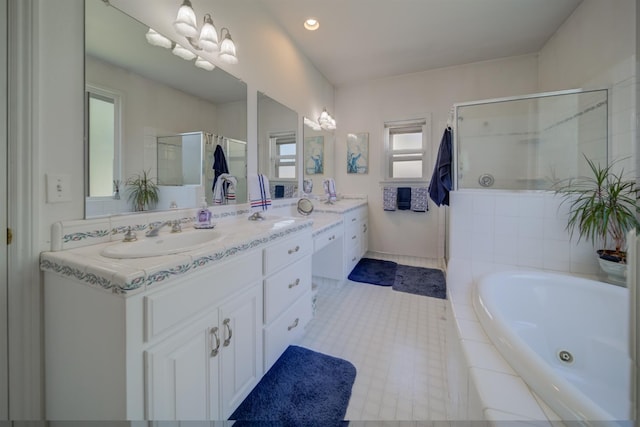 3543 Oak Shores Dr, Stockton, CA 95209 - full bathroom featuring double vanity, a jetted tub, a stall shower, and recessed lighting