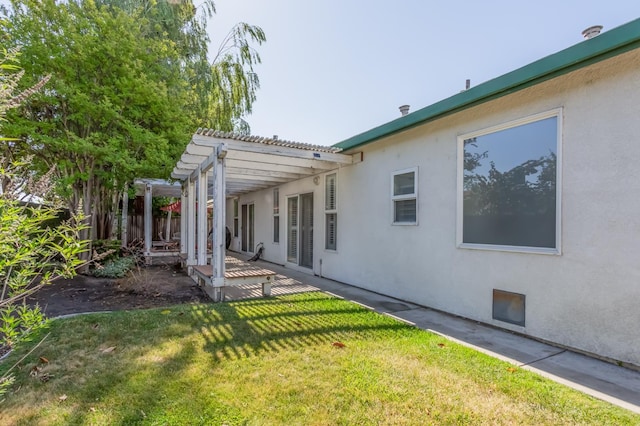 3543 Oak Shores Dr, Stockton, CA 95209 - rear view of property with a pergola, stucco siding, a lawn, and a patio area