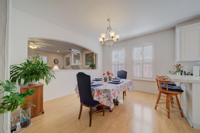 3543 Oak Shores Dr, Stockton, CA 95209 - dining room with light wood-style floors, a chandelier, baseboards, and ceiling fan