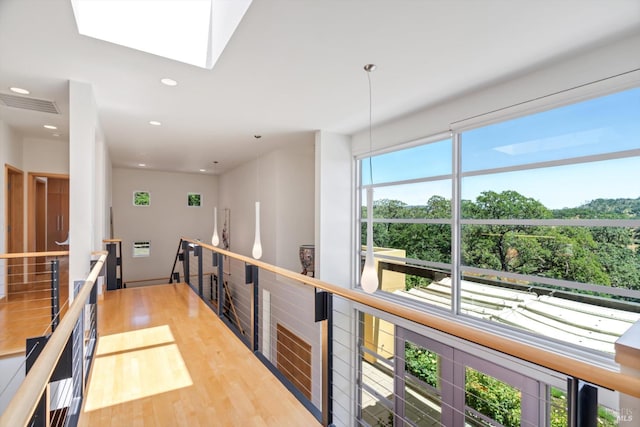 48 Longhorn Ridge Rd, Napa, CA 94558 - corridor with wood finished floors, an upstairs landing, a skylight, and recessed lighting