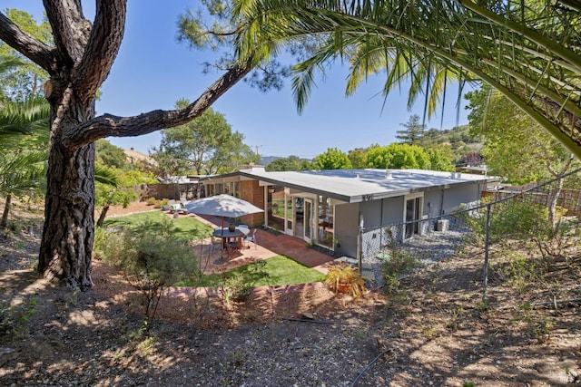 100 De La Guerra Rd, San Rafael, CA 94903 - back of property featuring a patio and a chimney