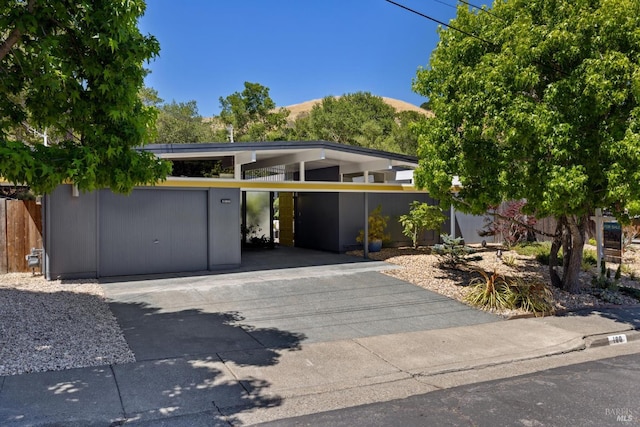 100 De La Guerra Rd, San Rafael, CA 94903 - view of front of property with driveway and a carport