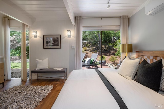 100 De La Guerra Rd, San Rafael, CA 94903 - bedroom with an AC wall unit, wood finished floors, access to exterior, and track lighting