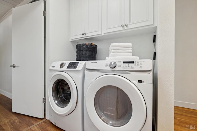 100 De La Guerra Rd, San Rafael, CA 94903 - laundry area featuring independent washer and dryer, baseboards, wood finished floors, and cabinet space