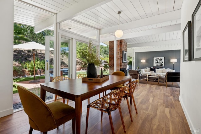 100 De La Guerra Rd, San Rafael, CA 94903 - dining area featuring baseboards, wood finished floors, a fireplace, and wood ceiling with exposed beams