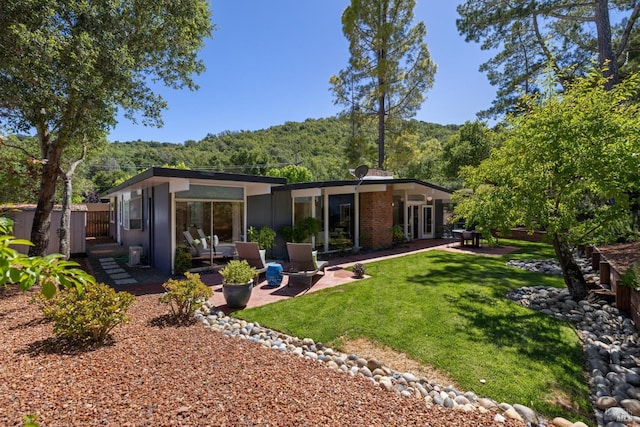 100 De La Guerra Rd, San Rafael, CA 94903 - rear view of property featuring a patio and a view of trees