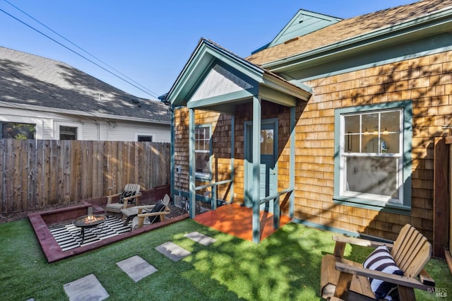 516 Howard St, Petaluma, CA 94952 - back of house featuring a fire pit and roof with shingles