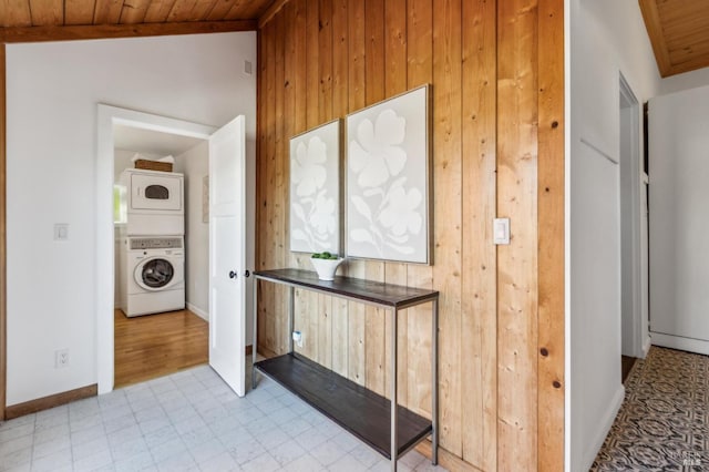 516 Howard St, Petaluma, CA 94952 - hall with stacked washer / drying machine, wood ceiling, wooden walls, and baseboards