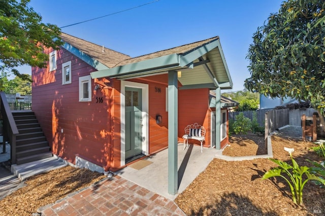 516 Howard St, Petaluma, CA 94952 - back of house featuring stairway and a shingled roof
