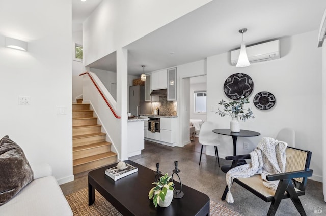 516 Howard St, Petaluma, CA 94952 - living room with a wall mounted AC, baseboards, and stairs