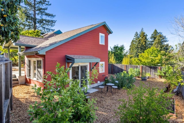 516 Howard St, Petaluma, CA 94952 - back of house featuring roof with shingles and a fenced backyard