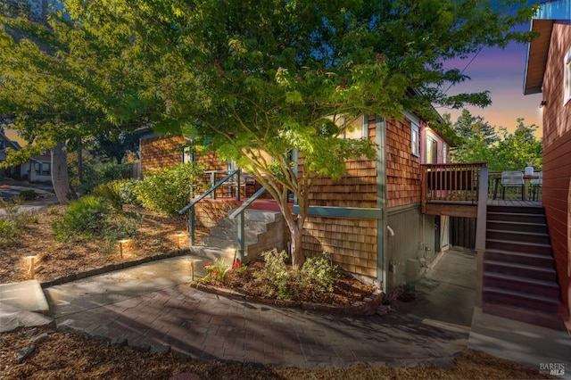 516 Howard St, Petaluma, CA 94952 - property exterior at dusk with stairway and a wooden deck