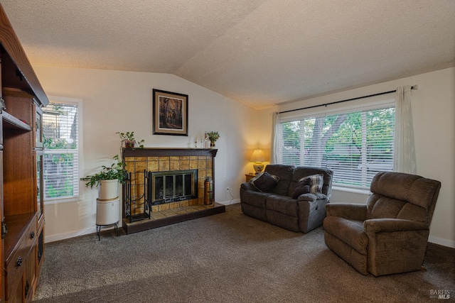 1133 Cielo Cir, Rohnert Park, CA 94928 - living room with lofted ceiling, a textured ceiling, carpet flooring, a tile fireplace, and healthy amount of natural light