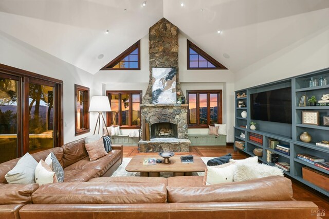 541 Oak Ave, San Anselmo, CA 94960 - living area featuring high vaulted ceiling, a fireplace, wood finished floors, and built in features