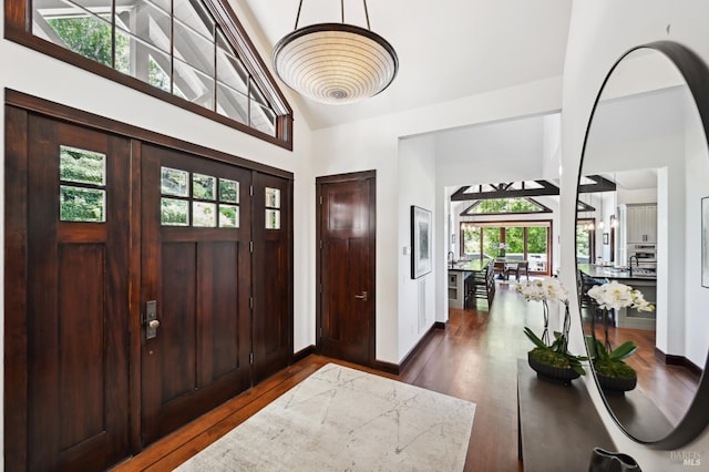 541 Oak Ave, San Anselmo, CA 94960 - entrance foyer featuring high vaulted ceiling, dark wood finished floors, and baseboards