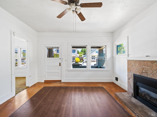442 Piper St, Healdsburg, CA 95448 - foyer entrance featuring wood-type flooring, a stone fireplace, ceiling fan, and baseboards