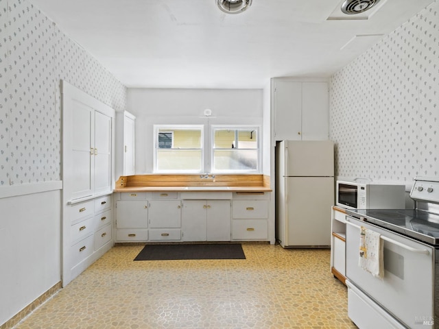 442 Piper St, Healdsburg, CA 95448 - kitchen featuring wallpapered walls, white appliances, and light flooring