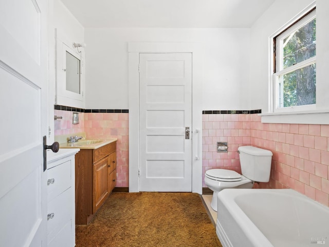 442 Piper St, Healdsburg, CA 95448 - full bathroom with tile walls, vanity, toilet, a tub, and wainscoting