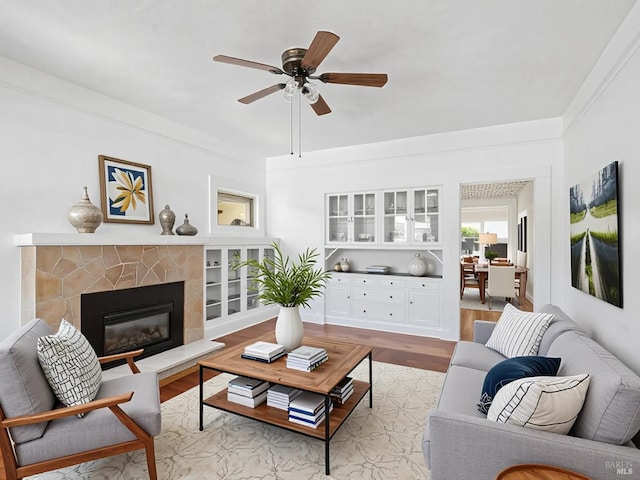 442 Piper St, Healdsburg, CA 95448 - living room with light wood-style floors, a ceiling fan, and a glass covered fireplace