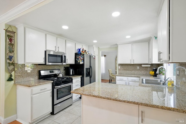 138 Nicole Way, Vallejo, CA 94589 - kitchen with stainless steel appliances, a peninsula, decorative backsplash, a sink, and recessed lighting