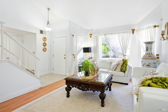 138 Nicole Way, Vallejo, CA 94589 - living area featuring stairs, wood finished floors, lofted ceiling, and baseboards