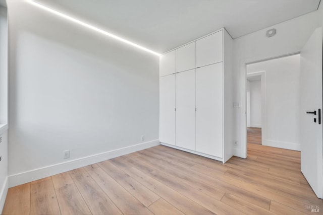 4966 Lakepointe Cir, Santa Rosa, CA 95403 - unfurnished bedroom featuring a closet, light wood-style flooring, and baseboards