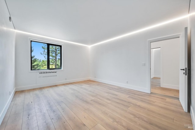 4966 Lakepointe Cir, Santa Rosa, CA 95403 - spare room featuring light wood-type flooring, baseboards, and an AC wall unit