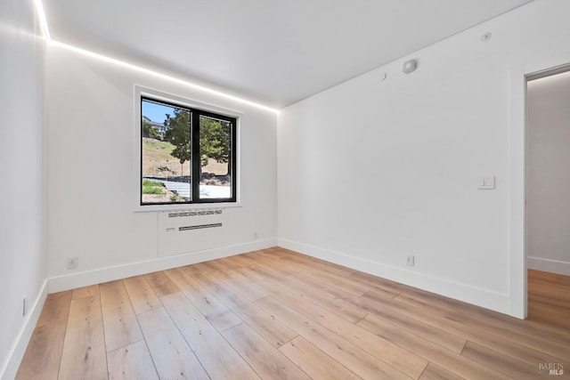 4966 Lakepointe Cir, Santa Rosa, CA 95403 - empty room featuring hardwood / wood-style flooring, baseboards, and a wall mounted air conditioner