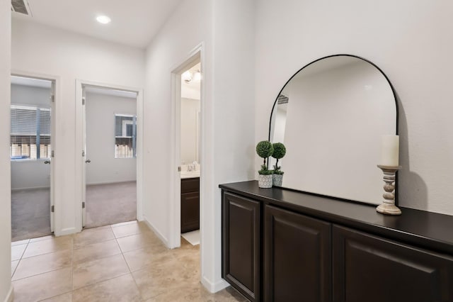 2032 Hunt St, Woodland, CA 95776 - corridor featuring light colored carpet, light tile patterned floors, recessed lighting, and baseboards