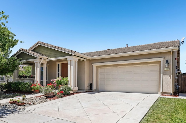 2032 Hunt St, Woodland, CA 95776 - view of front of home with driveway, a garage, stucco siding, and a tile roof