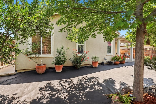2032 Hunt St, Woodland, CA 95776 - view of home's exterior with a patio and stucco siding